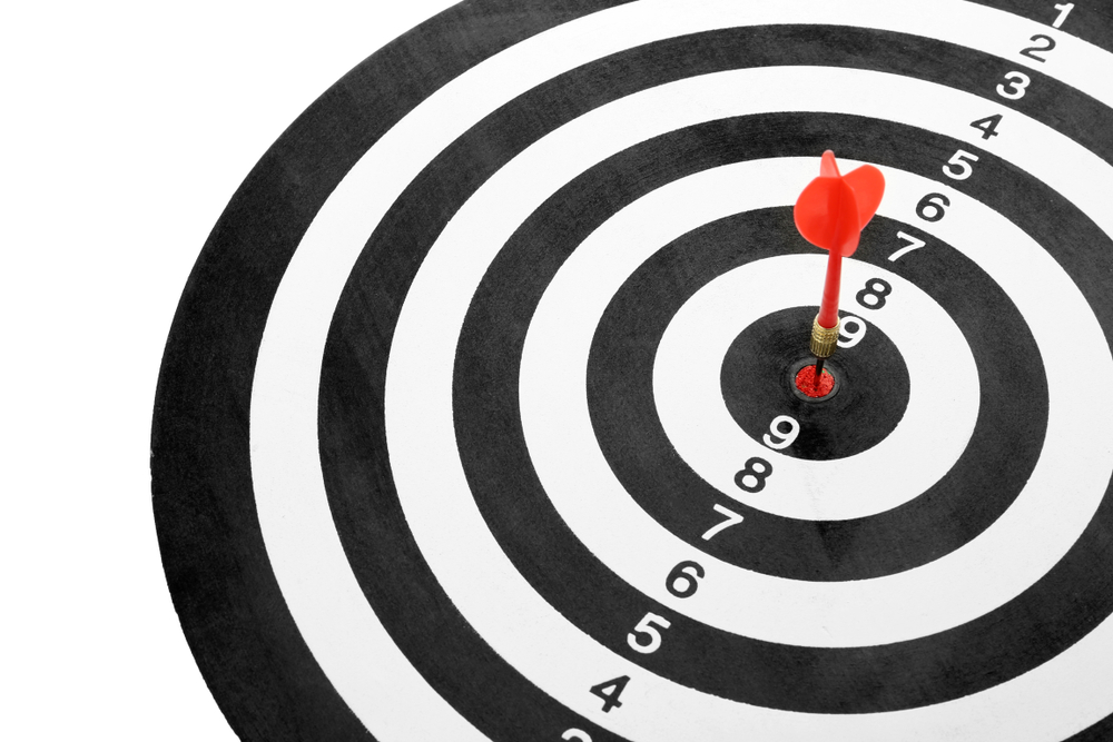 Red,Arrow,Hitting,Target,On,Dart,Board,Against,White,Background - Eight by Eight